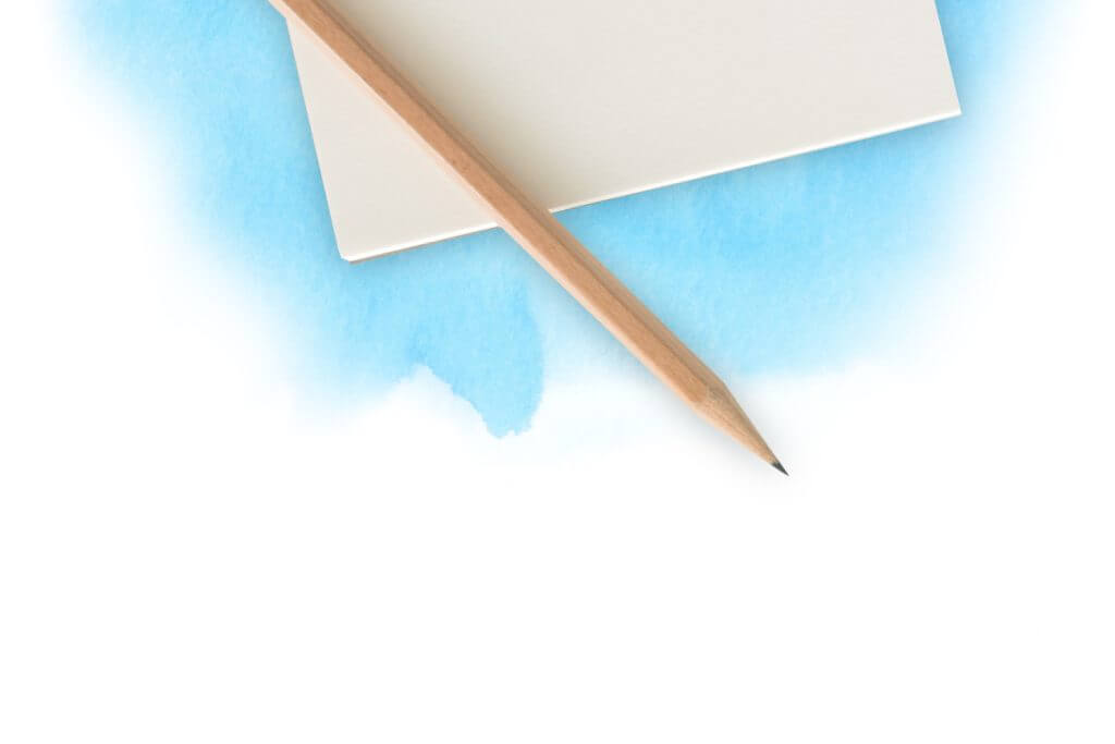 A pencil lying on a notepad